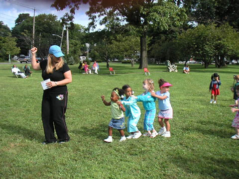 Woman guide/playing children in the play ground